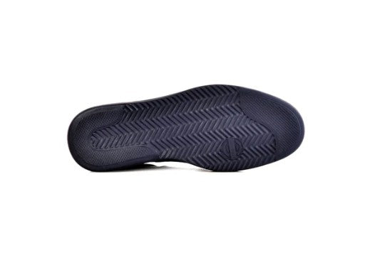 A close-up view of a dark navy blue shoe sole with a textured pattern, shown against a plain white background.