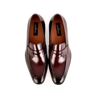 A pair of glossy dark burgundy leather penny loafers with a pointed toe, shown from a top-down view on a white background.