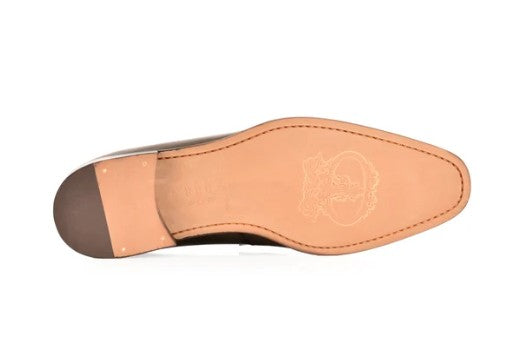 The underside of a men's dress shoe, showing a tan leather insole and a dark brown heel cap, photographed on a white background.