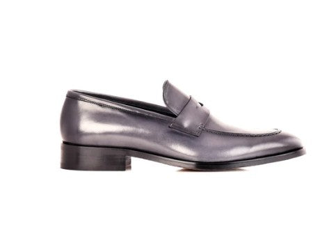 A single dark gray leather penny loafer with a low block heel, shown in a side profile on a white background.