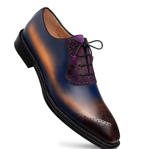 A men's oxford dress shoe with a gradient finish transitioning from deep navy blue to rich purple and dark brown, featuring black laces and a black sole.