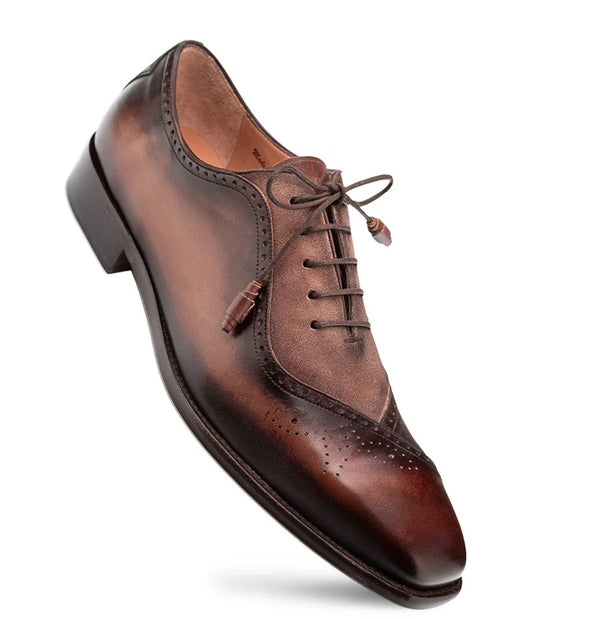 A single men's brown leather oxford shoe on a clean white background.