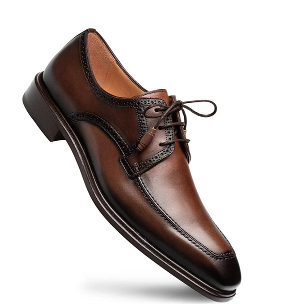 A single men's brown leather oxford dress shoe with brogue detailing and laces, shown at an angle on a clean white background.