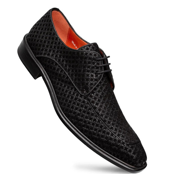 A men's black lace-up dress shoe with a textured, woven patterned upper and a contrasting bright orange interior lining.