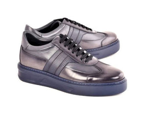 A pair of dark gray leather sneakers with black laces and thick navy blue platform soles, shown on a plain white background.