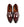 A pair of glossy dark burgundy leather penny loafers with a pointed toe, shown from a top-down view on a white background. 
