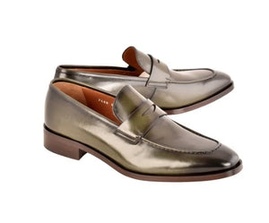 A pair of green leather penny loafers with a polished finish, displayed on a clean white background.