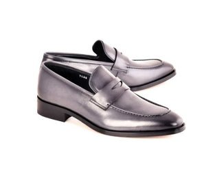 A pair of men's penny loafers in a gray leather, shown from a three-quarters angle on a plain white background.