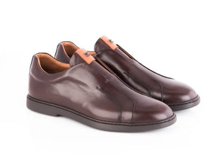 A pair of men's dark brown leather slip-on loafers with a smooth finish, shown on a white background.