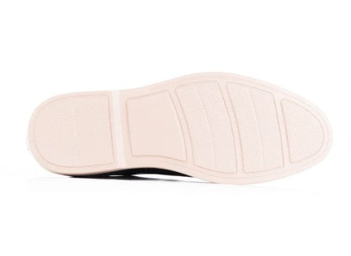 The rubber outsole of a shoe, showing its tread pattern, photographed on a white background.