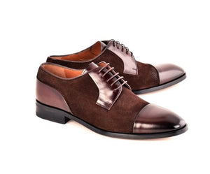 A pair of men's brown cap-toe oxford shoes with a mix of textured suede and smooth leather panels, shown on a plain white background.