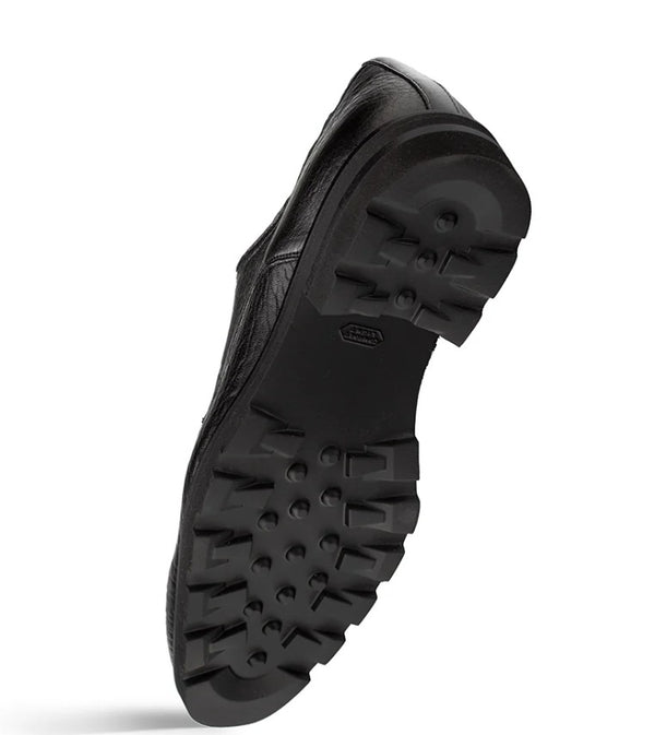 A black leather shoe shown from the sole side set against a plain white background.