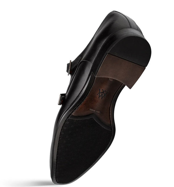 A black leather men's dress shoe shown from a high-angle side view, displaying the side profile, sole, and a brown heel counter on a white background.