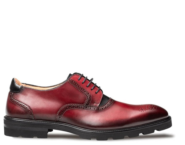 A single men's oxford-style dress shoe in glossy burgundy leather with black trim, black laces, and a black lug sole