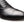 Close-up of a black leather oxford dress shoe showing the cap toe, laces, and side stitching against a white background.