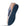 A single casual slip-on shoe shown from a side angle, featuring a navy blue textured sole, a navy blue side panel, a tan suede heel, and a blue denim-like side section on a white background.
