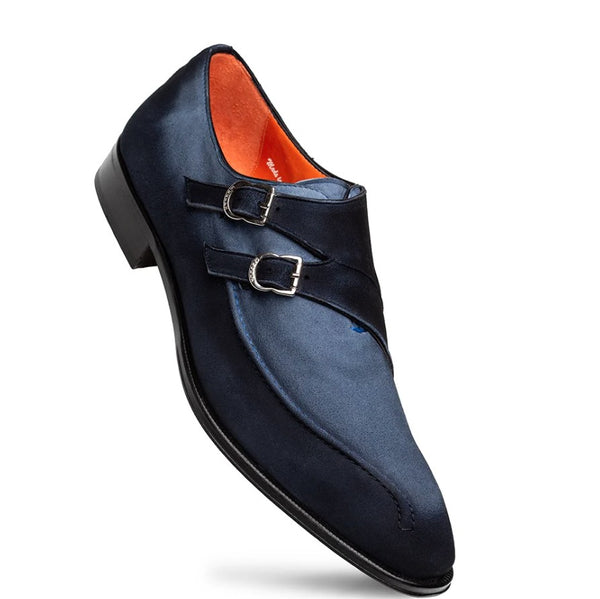 A navy blue double strap leather dress shoe with silver buckles and a bright orange interior lining, shown on a white background.