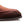 Close-up of a dark brown suede shoe toe and a dark sole, shown on a white background.