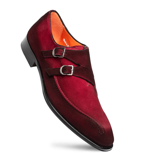A single men's double buckle oxford shoe in deep burgundy suede, featuring silver-tone metal buckles, a black sole, and a bright orange interior lining.