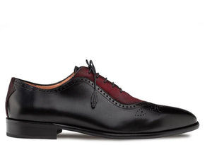 A black leather wingtip oxford shoe with a contrasting burgundy suede wingtip panel, black laces, and a low stacked heel, shown in profile against a white background.