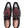 A pair of Mezlan men's wingtip oxford shoes shown from a top-down view. The shoes feature a black leather brogue toe and quarter panels with a contrasting dark red suede vamp, black laces, and a tan insole with the Mezlan logo.