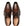 A pair of brown leather dress shoes with a glossy finish, featuring a cap toe, decorative brogue detailing, and dark brown laces. The brand name 'MEZLAN' is printed in gold on the tan insole.