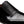 Close-up of a black leather slip-on dress shoe with brogue detailing on a white background.