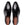 A pair of black leather men's dress shoes with brogue detailing, shown from a top-down view on a white background. The brand name 'MEZLAN' is visible on the tan insoles.