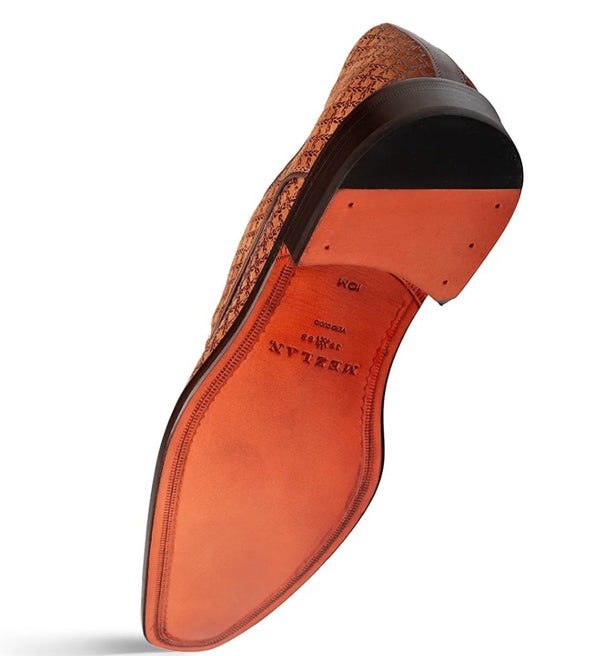 A single men's dress shoe shown from the sole side, featuring a black heel, and a warm orange leather insole.
