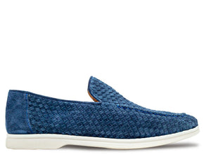 A single blue woven slip-on loafer with a textured pattern and a white sole, shown in profile against a white background.