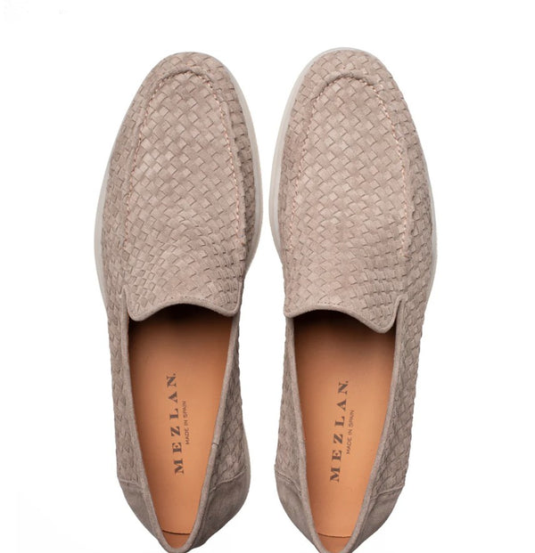 A pair of Mezlan woven slip-on loafers in taupe, shown from a top-down view on a white background.